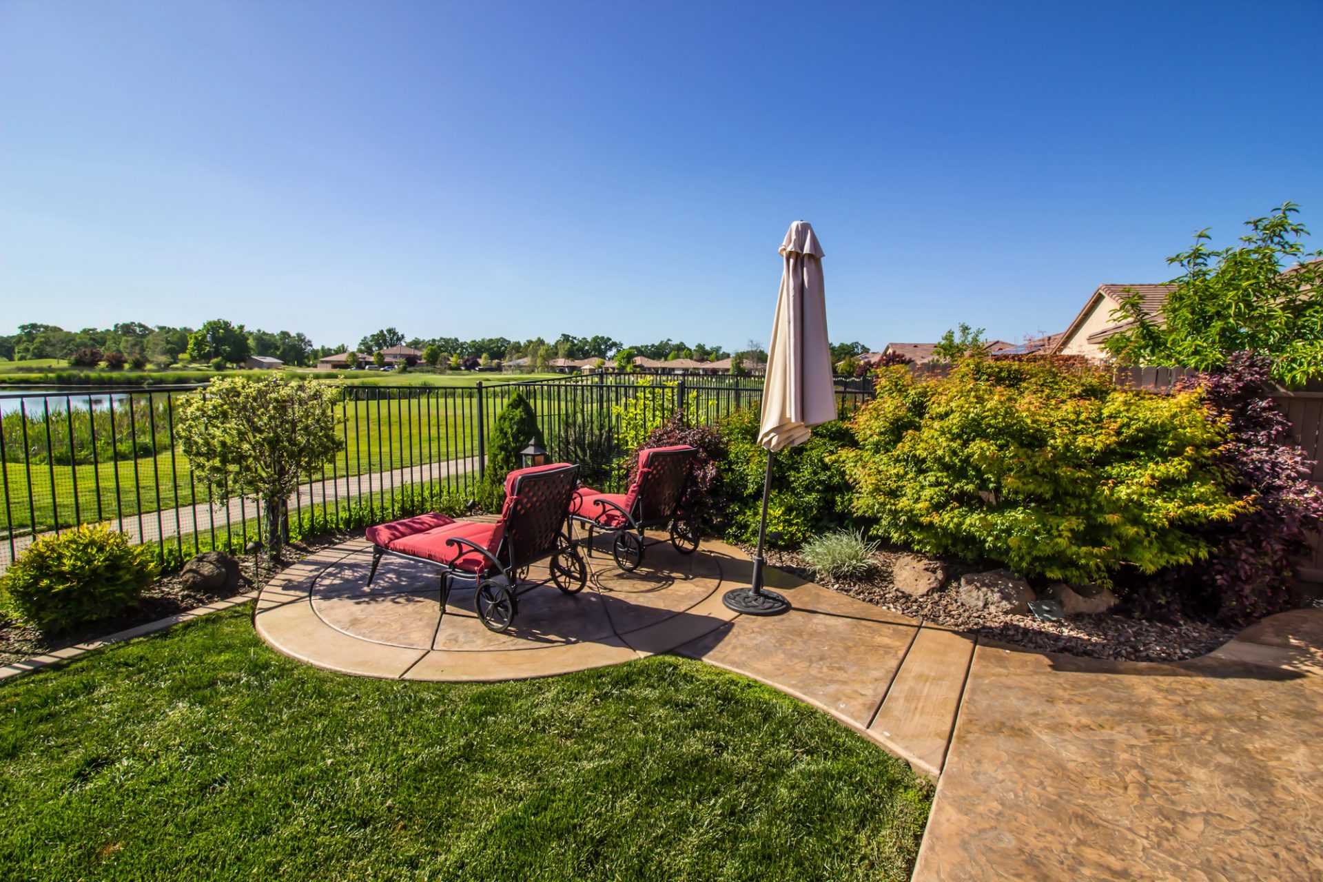 Decorative stamped concrete patio with a two-tone geometric pattern<br />
