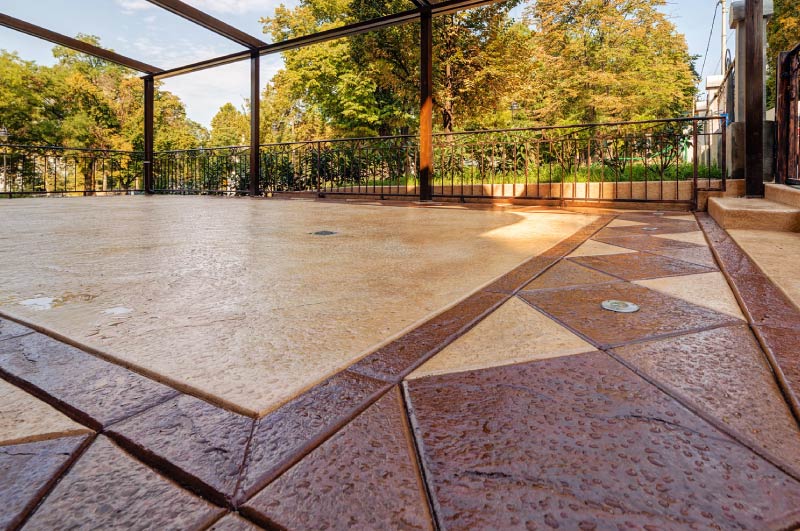 stamped-concrete-finished Decorative stamped concrete patio with a two-tone geometric pattern<br />